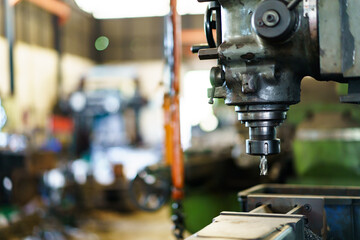 Close up shoot showing a drilling - lathing machine in operating.