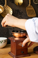 Making coffee in the kitchen, manual coffee grinder