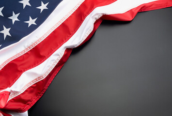 USA or american flag folded on a stone background