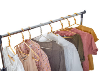 Second-hand clothes on the rail on a light background. The concept of sustainable economic life. 