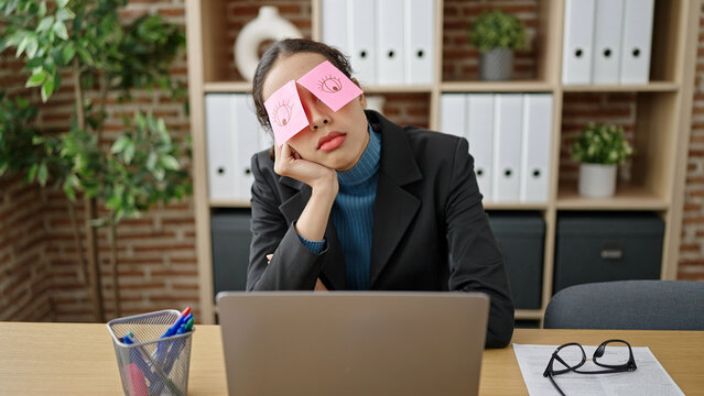 Young beautiful hispanic woman business worker tired with reminders covering eyes at office