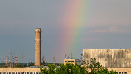Rainbow over urban industrial area.