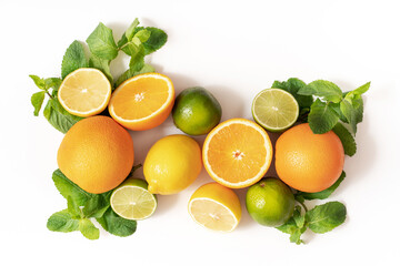 Summer cocktails with citrus fruits orange lemon lime mint and rosemary on a white background. Summer party concept. Trendy palm leaf shadow and sunlight.