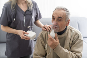 Elderly Senior Man nursing care wear oxygen inhaler device for helping breath respiratory. Oxygen Concentrator portable - Powered by Adobe
