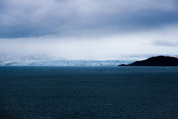 Cruise to Hubbard Glacier Bay in Alaska with floating ice bergs and drift ice floes on ocean water...