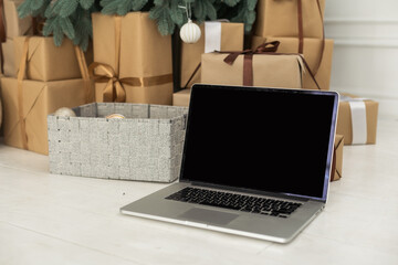 Laptop on background of Christmas interior