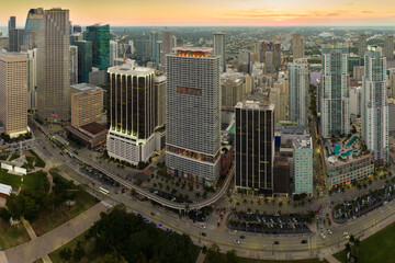 Aerial view of downtown office district of Miami Brickell in Florida, USA at sunset. High commercial and residential skyscraper buildings in modern american megapolis - obrazy, fototapety, plakaty