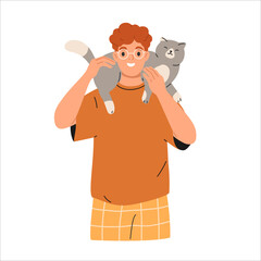 Cute happy cat lying on owners shoulder. Smiling man holding cute adorable kitty.