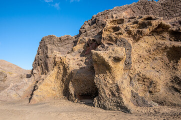Fototapeta premium Ventifact rock formations caused by wind at La Pared Beach, Fuerteventura
