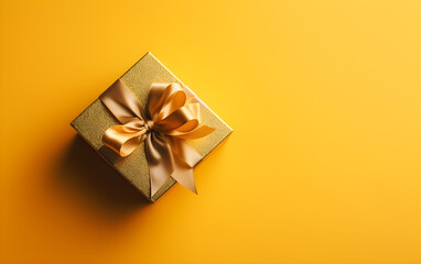 Obraz na płótnie Canvas Gift box with golden bow on yellow background. Top view. Generative AI.