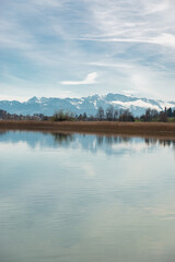 Fototapeta premium Lake Pfaeffikersee with the mountains in the background in Zurich in Switzerland