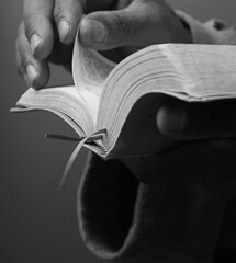 black man praying to god with hands together Caribbean man praying stock photo	