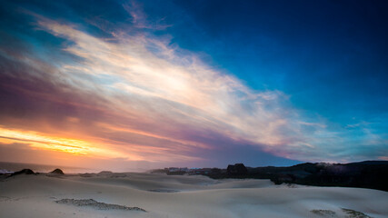 Fototapeta premium A beautiful sunset over the beach at Cannon Rocks in the Eastern Cape, South Africa.