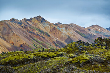 Fototapeta na wymiar Valley National Park Landmannalaugar. rhyolite mountains and hills covered with moss in a national park in Iceland in August.