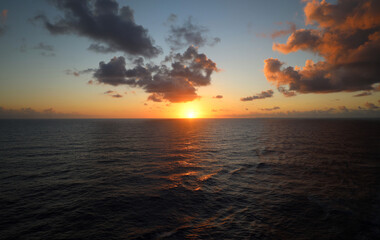 Fototapeta na wymiar Caribbean sunrise in purple clouds glory