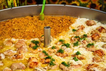 Cooked cabbage and pork knuckle in big pot.