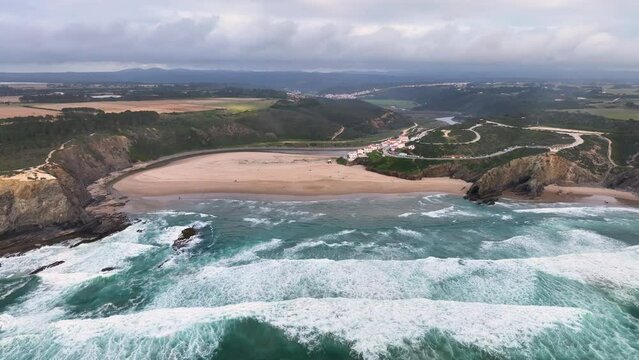 Aerial view of Praia de Odeceixe along Ribeira de Seixe river, Odeceixe, Faro, Portugal.