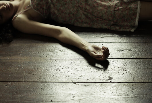 Cropped image of a woman lying on the floor
