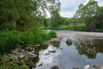 Naklejka na ściany i meble River landscape - The river Eder in a green landscape