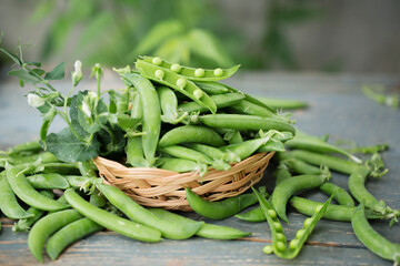 fresh peas on a wooden table