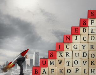 Enterprising businessman with missile wants to climb the scale cubes with written business