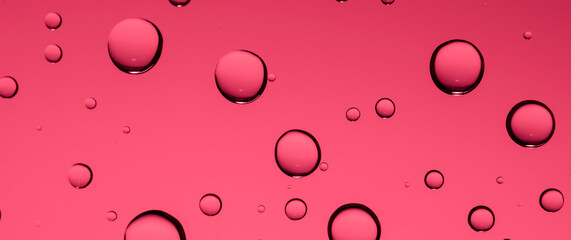 red raindrops on the glass, background or texture