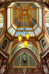 Iconic painted roof of the Leadenhall market. Built in 1881. There are many bars restaurants and shops. Famous tourist sight in London city.