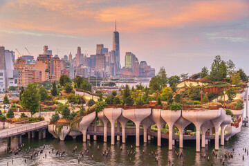 Cityscape of downtown Manhattan skyline with the Little Island Public Park in New York City at sunrise