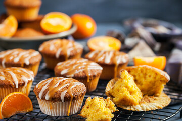 Carrot tangerine cupcakes decorated with glaze and caramel topping