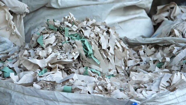 Lots of paper in the waste paper warehouse. Paper collection point for recycling.