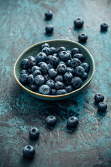 Blueberry - antioxidant organic superfood in a bowl concept for healthy eating and nutrition