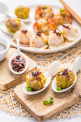 Assortment of steamed dumplings Dim Sum on kitchen table