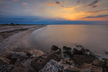 sunrise at sea on a rocky shore. Black Sea, Romania