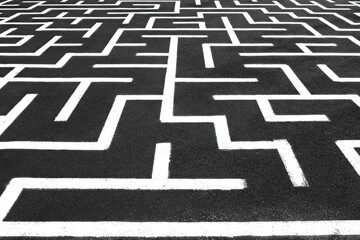 White maze on the floor. Аsphalt with white straigt lines. Labyrinth on a pavement. Playground with a drawing all over.