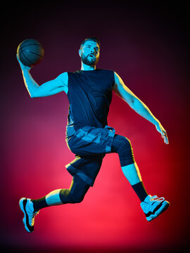 one basketball player man Isolated on black background