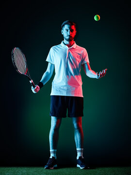 one caucasian tennis player man studio isolated on black background