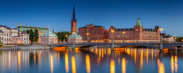 Fototapeta na wymiar Panoramic image of Stockholm, Sweden during twilight blue hour.
