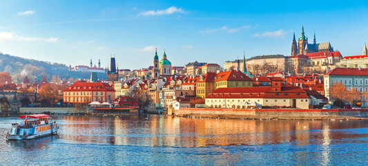 Old town of Prague, Czech Republic over river Vltava with Saint Vitus cathedral on skyline. Bright...