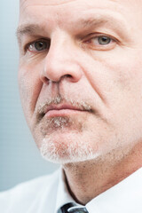 closeup portrait of a senior trustworthy manager that means expertise for your corporate business