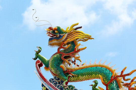 Ornate Colorful Chinese Dragon on rooftop of Chinese temple