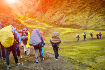 hikers with backpacks on the trail in the mountains. Trek in Iceland