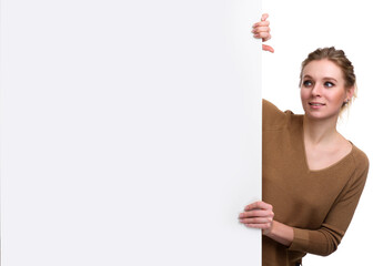 Portrait of young beautiful woman with a blank banner © Designpics