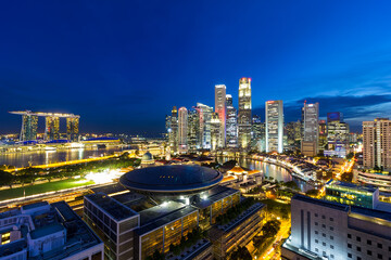 Singapore Central Business District and Marina Bay along Singapore River during evening twilight blue hour