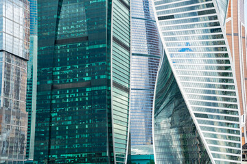 Fototapeta na wymiar modern skyscraper buldings of iron and glass reflecting background