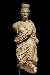 Tyche goddess marble statue from ancient Perge city. Vertical, isolated, black background. Antalya,...