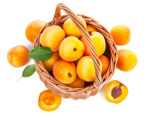 Fresh apricot with green leaf in wicker basket still life of fruits, isolated on white background and copyspace top view