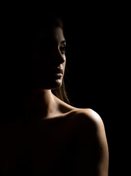 silhouette of nude beautiful asian woman on black background.