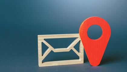 Envelope and red geolocation map pin. Messages and notifications with a geographic context. Staying...