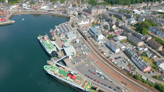 Aerial drone video of the ferry terminal in the coastal town Oban in Scotland