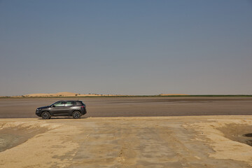 Fototapeta na wymiar Driving 4X4 Car through the desert Dammam, Saudi Arabia.